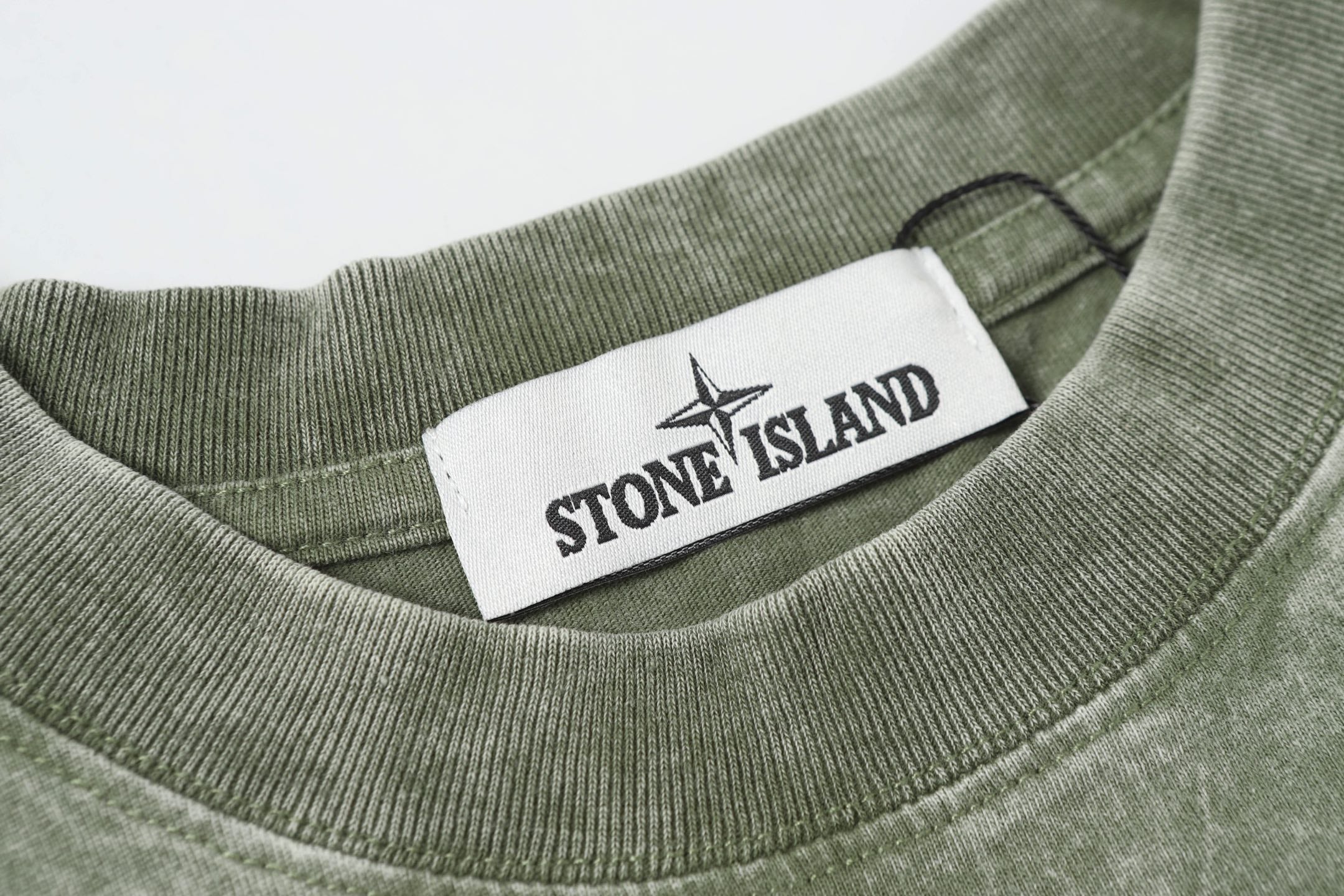 Stone Island T-shirt collar with crew rib knit and brand neck label on sage green