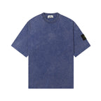 Blue crew-neck T-shirt, short sleeves, Stone Island sleeve patch.