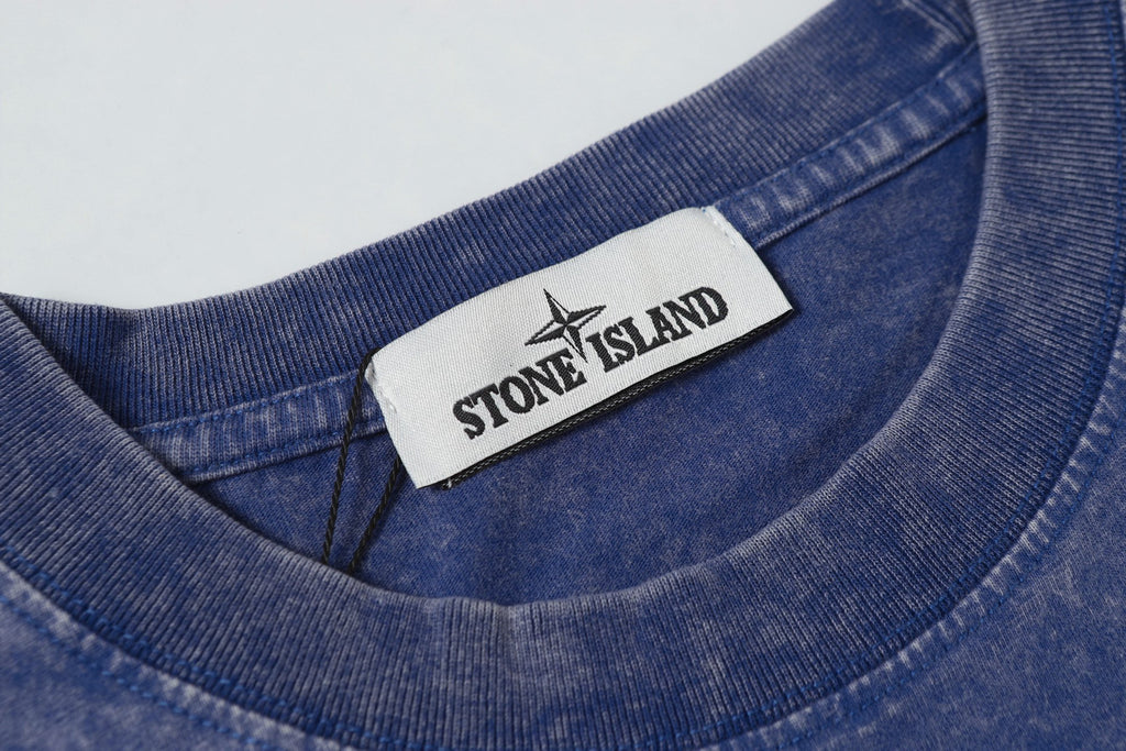 Blue crew-neck T-shirt with Stone Island inner collar label.