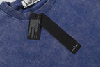 Blue crew-neck T-shirt collar with Stone Island neck label and hang tag.