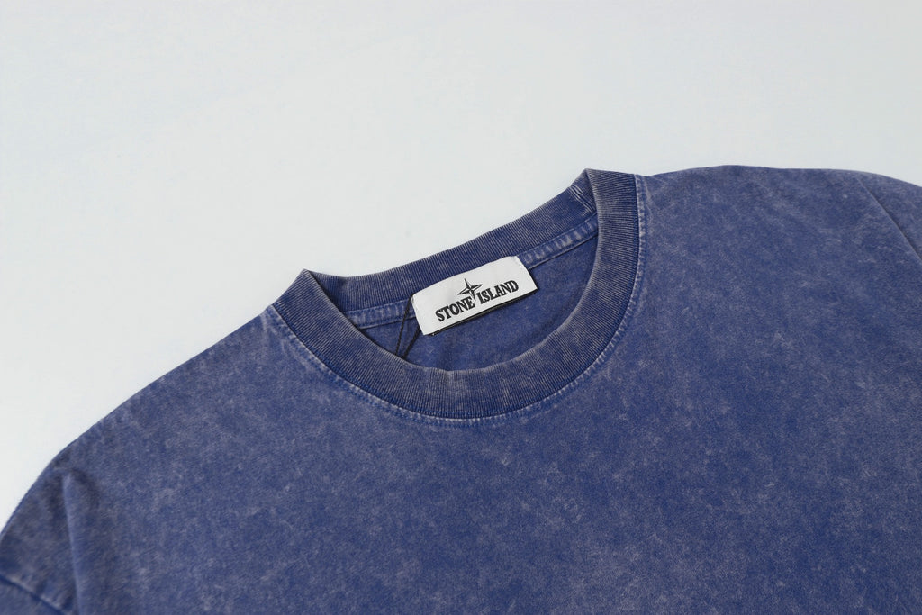 Blue crew-neck T-shirt with Stone Island neck label at collar.