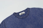 Blue crew-neck T-shirt with Stone Island neck label at collar.
