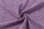 Lavender T-shirt fabric texture with soft knit and visible seam lines.