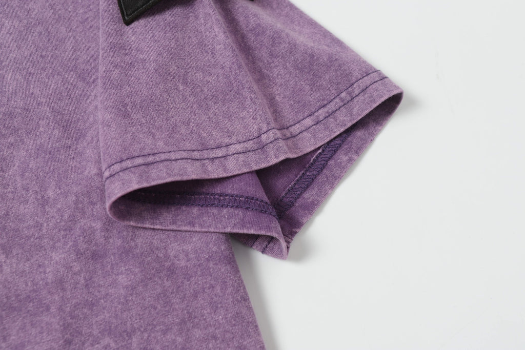 Stone Island T-shirt sleeve and hem with stitched edges in lavender.