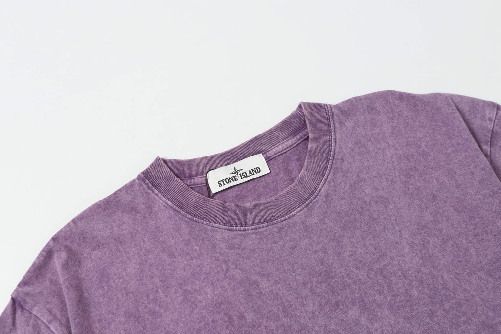Stone Island T-shirt in lavender with ribbed crew neck and short sleeves.