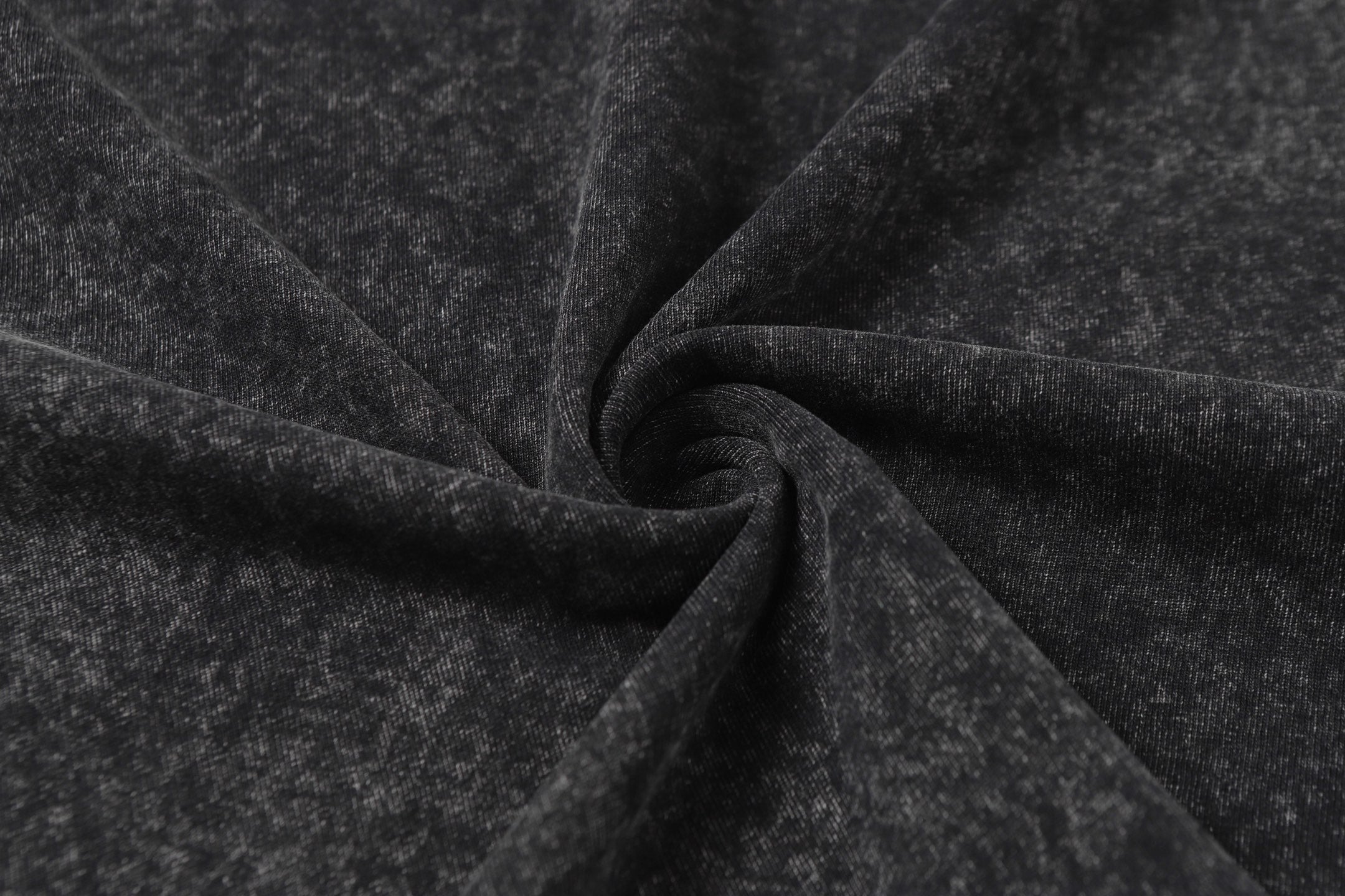 Dark charcoal T-shirt fabric knot with heathered speckle weave texture