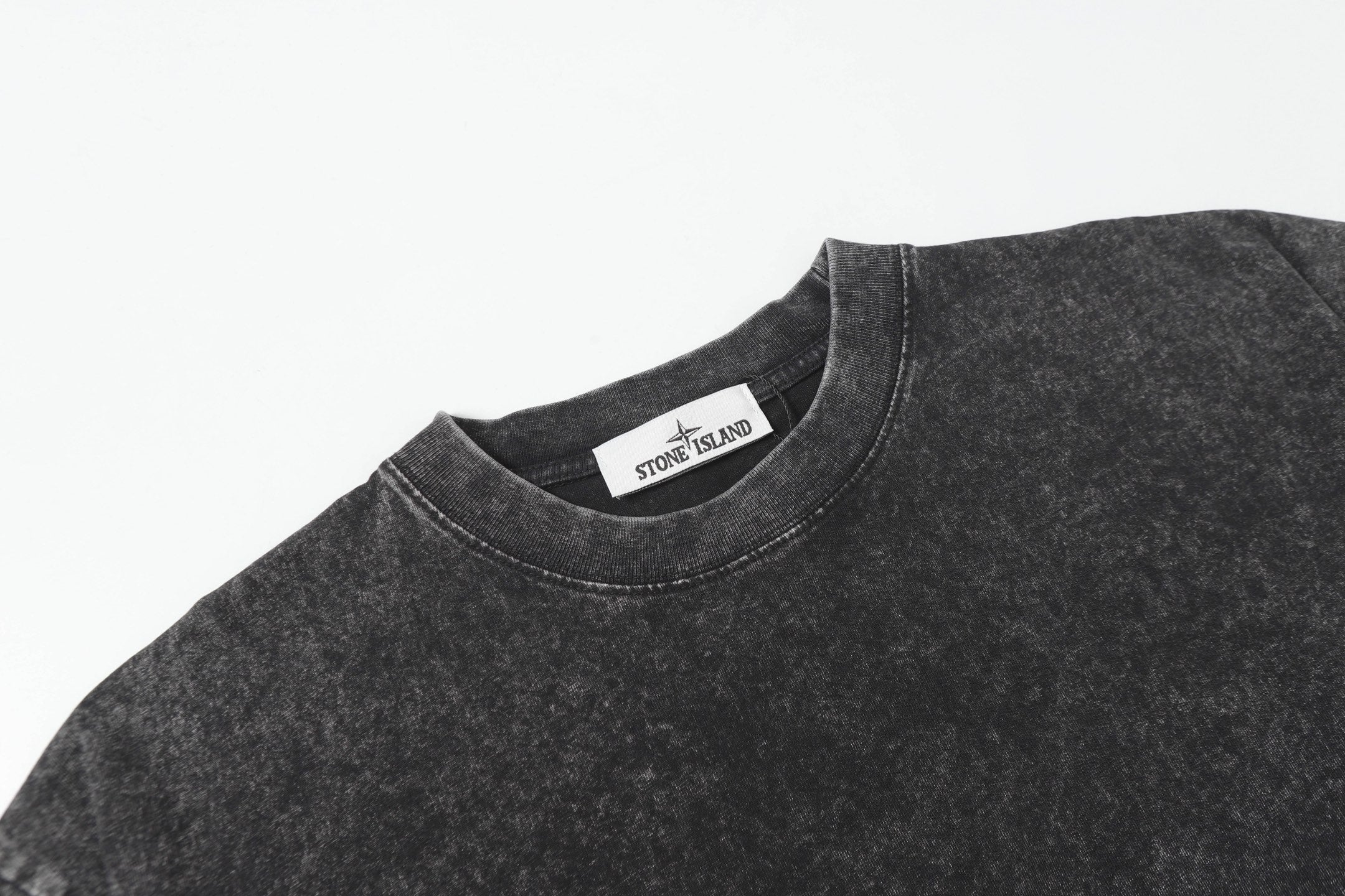 Dark charcoal crewneck T-shirt with inner neck label visible