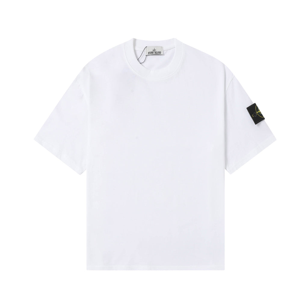 White Stone Island T-shirt with crew neck and small black logo patch on sleeve.