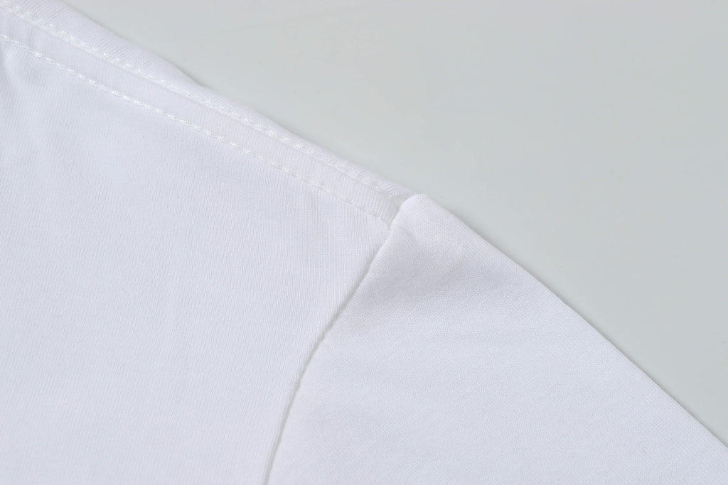 White Stone Island T-shirt fabric with stitched seam at shoulder.