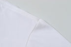 White Stone Island T-shirt fabric with stitched seam at shoulder.