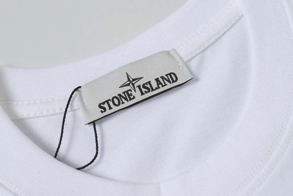 White Stone Island T-shirt with brand neck label inside collar.