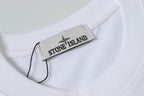 White Stone Island T-shirt with brand neck label inside collar.