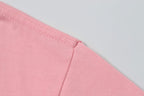 Pink T-shirt side seam with stitched hem detail