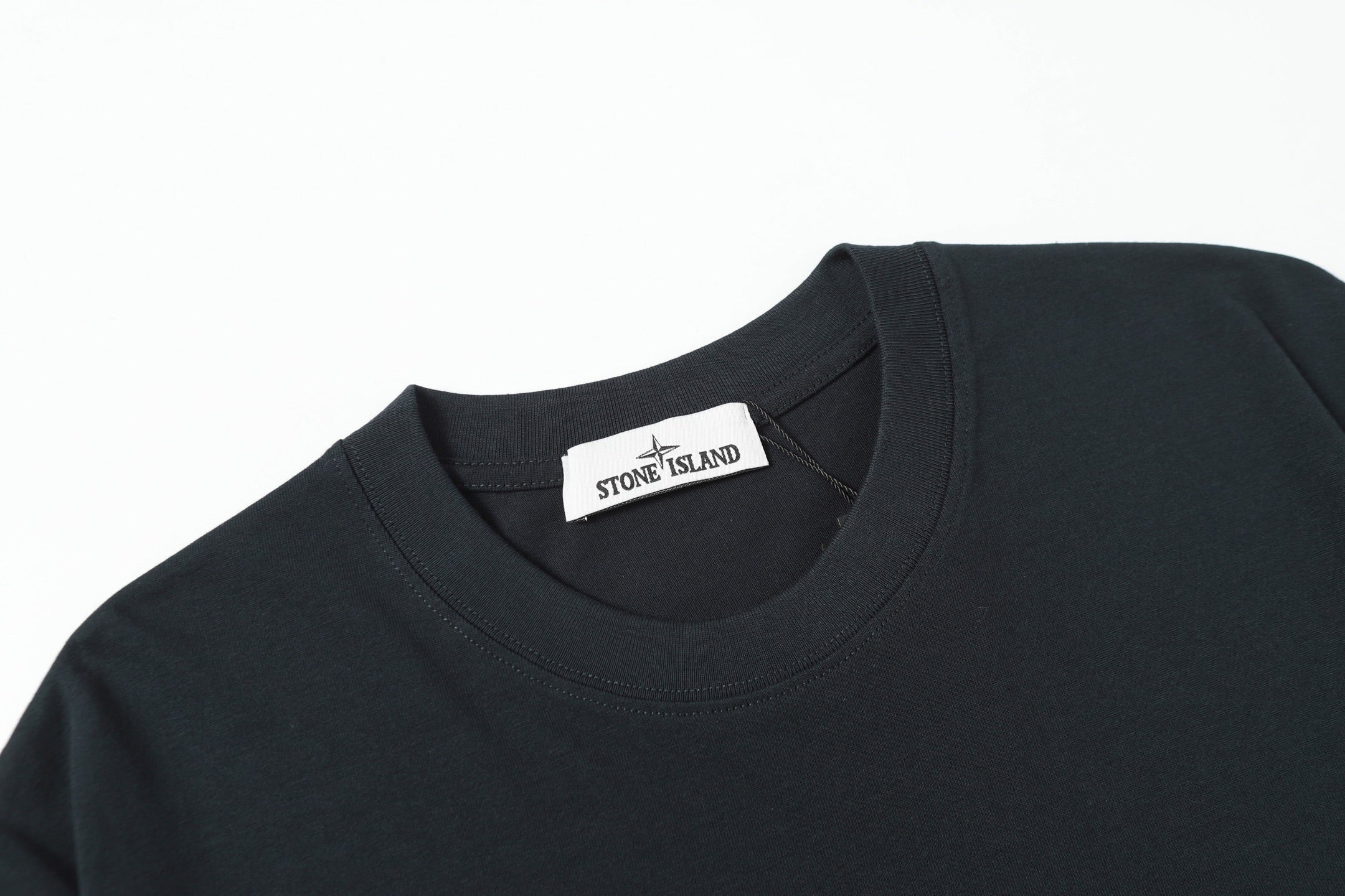 Stone Island crew-neck T-shirt in dark color with neck brand label