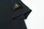 Stone Island T-shirt sleeve label and small yellow logo patch detail