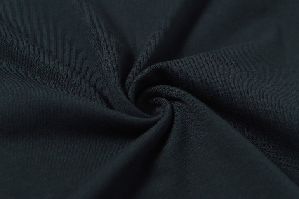 Stone Island T-shirt fabric close-up showing knit texture in dark color