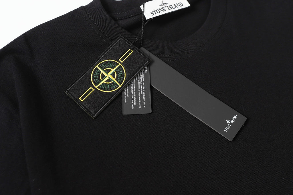 Black crew-neck T-shirt with Stone Island logo label on chest