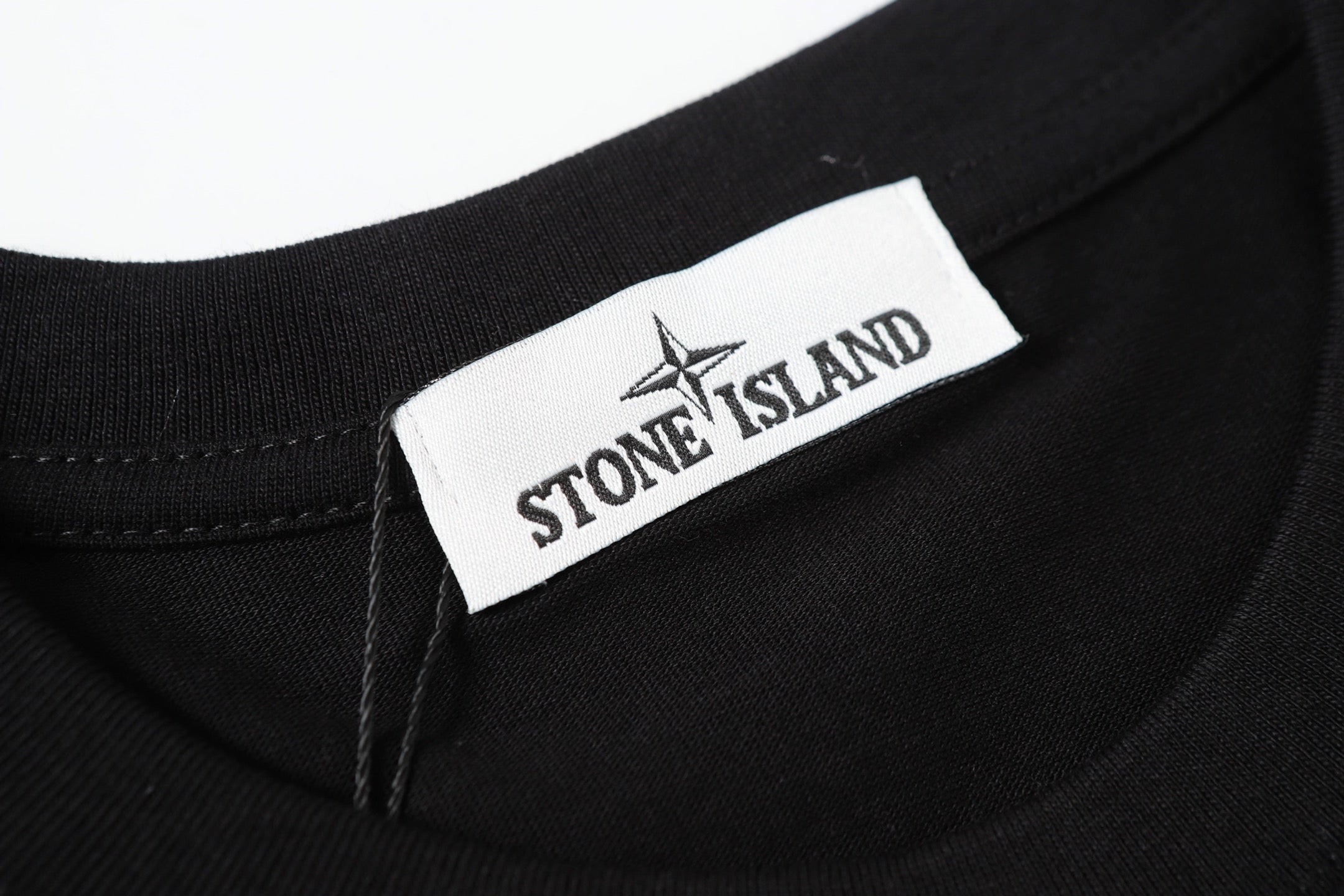 Black crew-neck T-shirt with Stone Island neck label