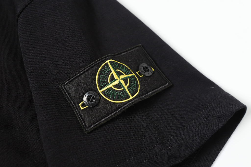 Black short-sleeve T-shirt with embroidered Stone Island patch on cuff