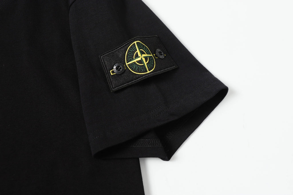 Black T-shirt sleeve patch with yellow emblem detail
