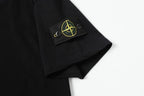 Black T-shirt sleeve patch with yellow emblem detail