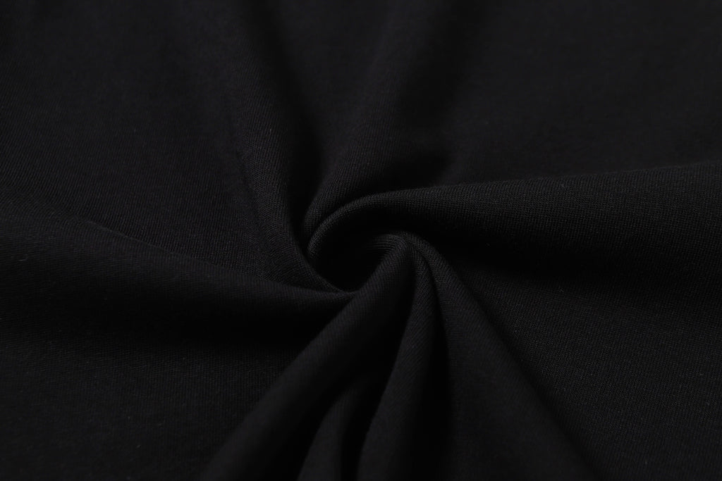 Black T-shirt fabric close-up, smooth knit texture