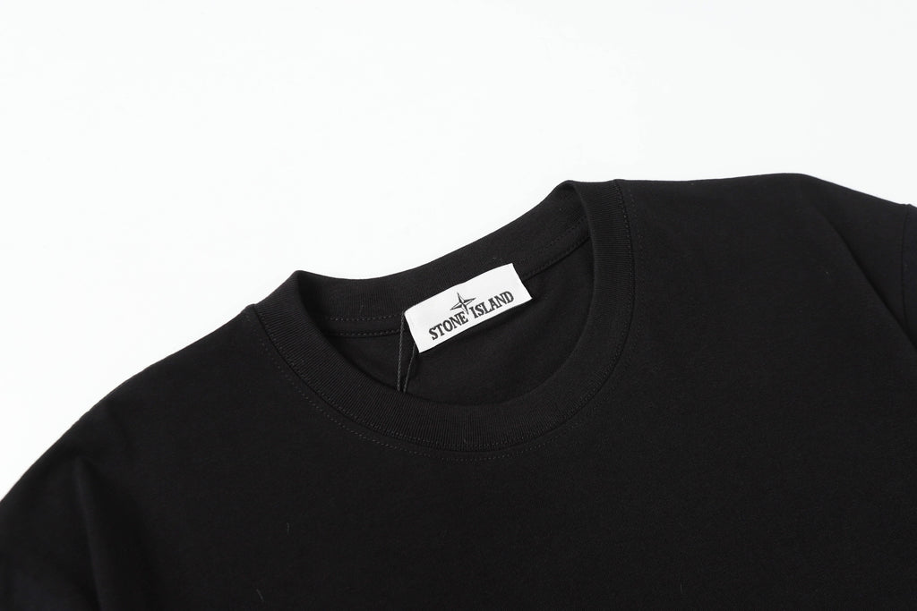 Black crew-neck T-shirt collar with Stone Island tag