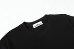 Black crew-neck T-shirt collar with Stone Island tag