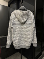 Back view of gray zip hoodie with Dior monogram print and CHRISTIAN DIOR logo stripe