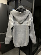 Back of gray zip-up hoodie with hood, off-white stripe band, and CHRISTIAN DIOR logo