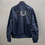 Navy bomber jacket back view with large Dior logo embroidery, ribbed collar and cuffs.