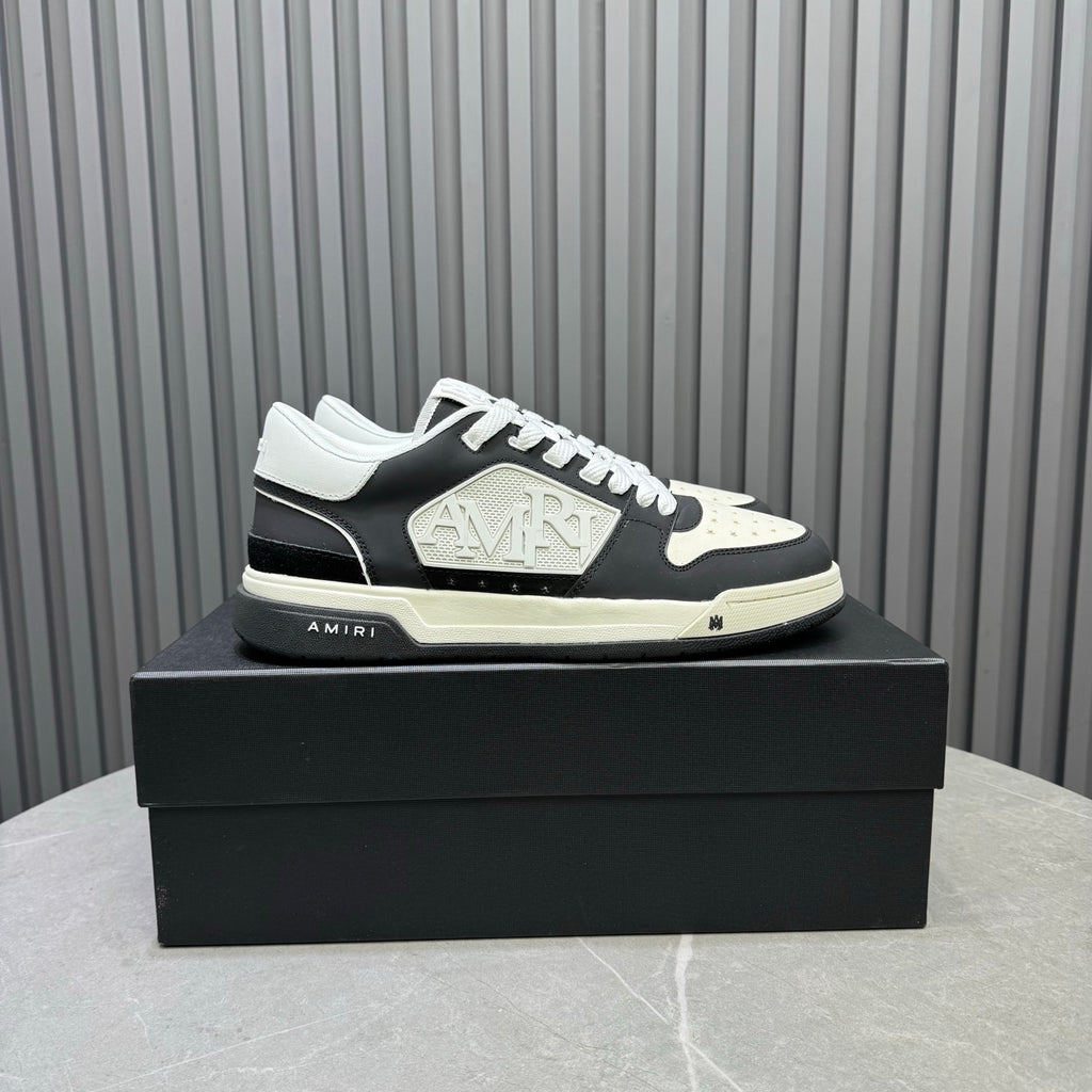 Amiri lace-up sneakers in black and white with embossed logo on the side