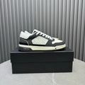 Amiri lace-up sneakers in black and white with embossed logo on the side