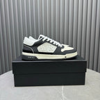 Amiri lace-up sneakers in black and white with embossed logo on the side