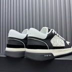 Amiri low-top sneakers, heel and side view in black and white with thick sole