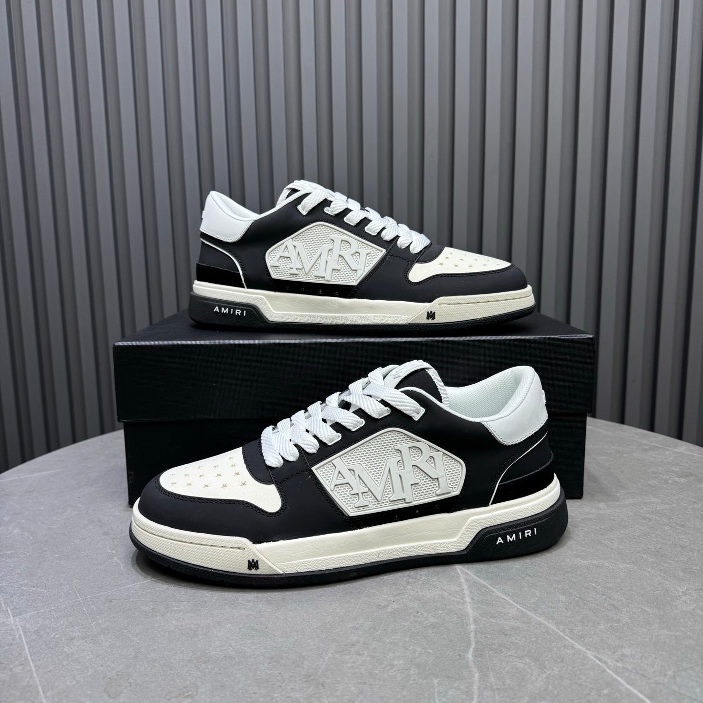 Amiri lace-up sneakers set, black upper with white panels and raised logo emblem