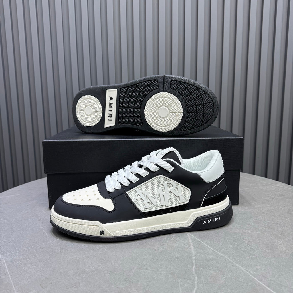 Amiri sneakers with patterned outsole and side logo on black-and-white pair