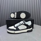 Amiri sneakers with patterned outsole and side logo on black-and-white pair