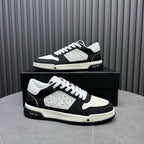 Amiri lace-up sneakers on box, black-and-white side profile with logo plate