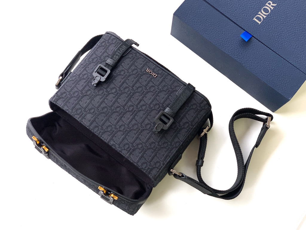 Dior crossbody bag in dark gray monogram canvas with flap, strap, and small front pocket