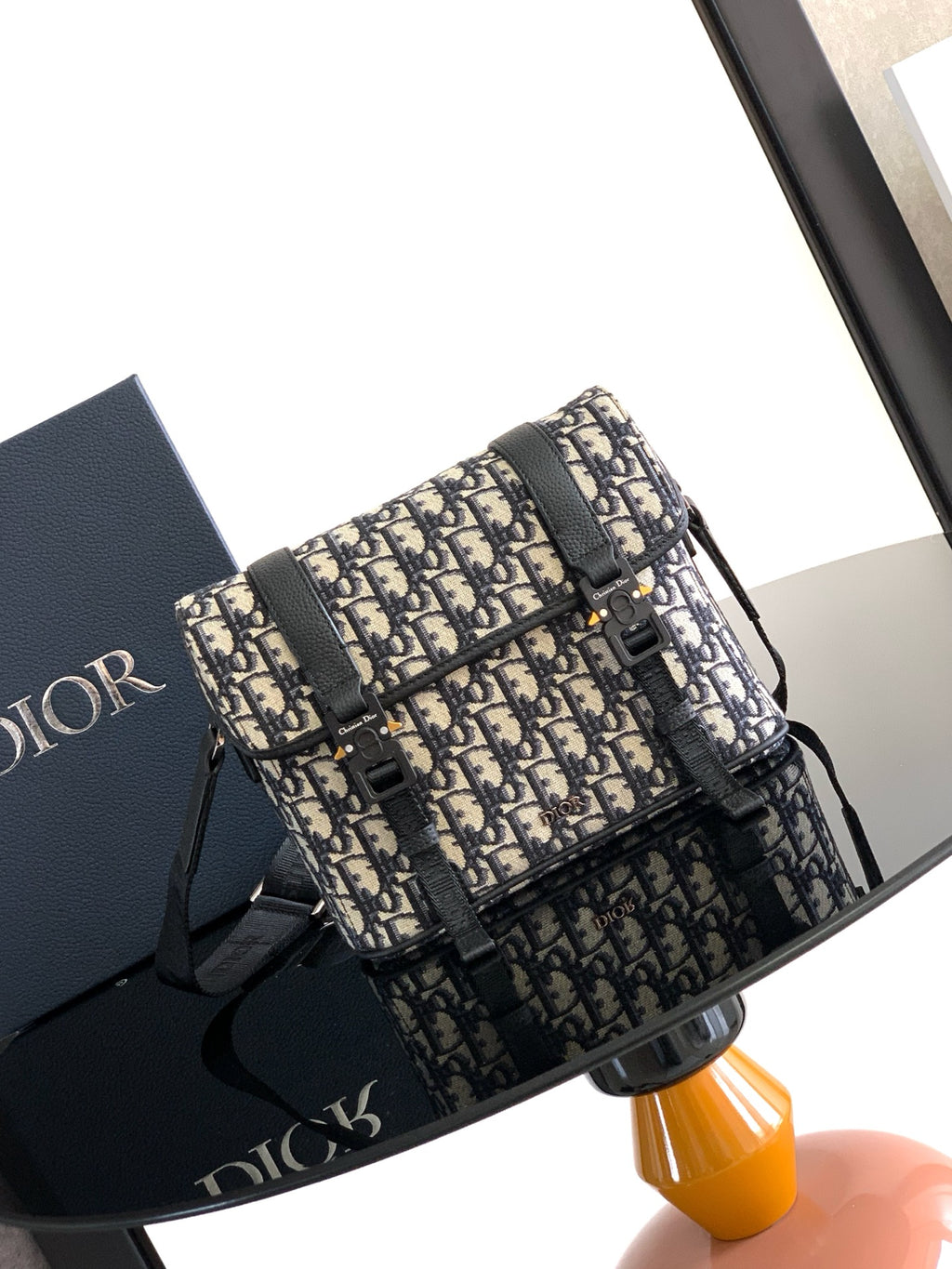 Dior bag with Dior monogram canvas, black leather trim, and top flap closure