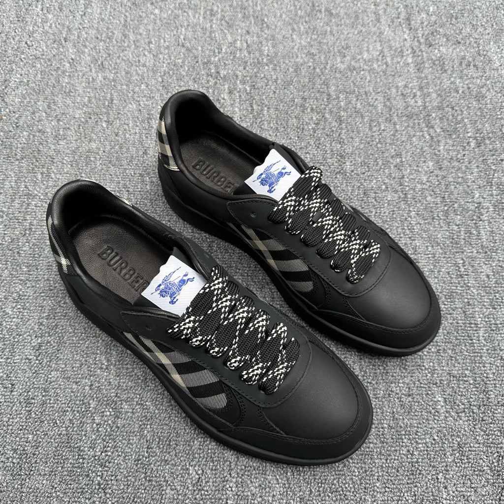 Black lace-up sneakers with check-pattern side panels and logo tags