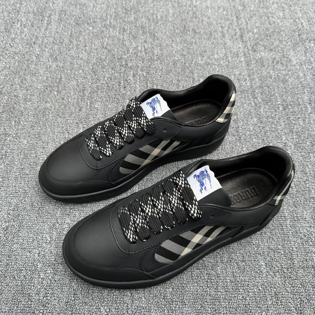 Black sneakers pair with check-pattern side panels and lace-up closure