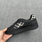 Black sneakers with check-pattern side panel and lace-up closure