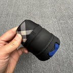 Black sneaker heel with check-pattern fabric insert and blue outsole detail