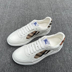 White sneakers with plaid side panels, lace-up front, and blue horse logo