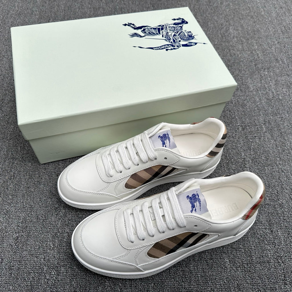 White leather sneakers with plaid side panels and blue logo on tongue