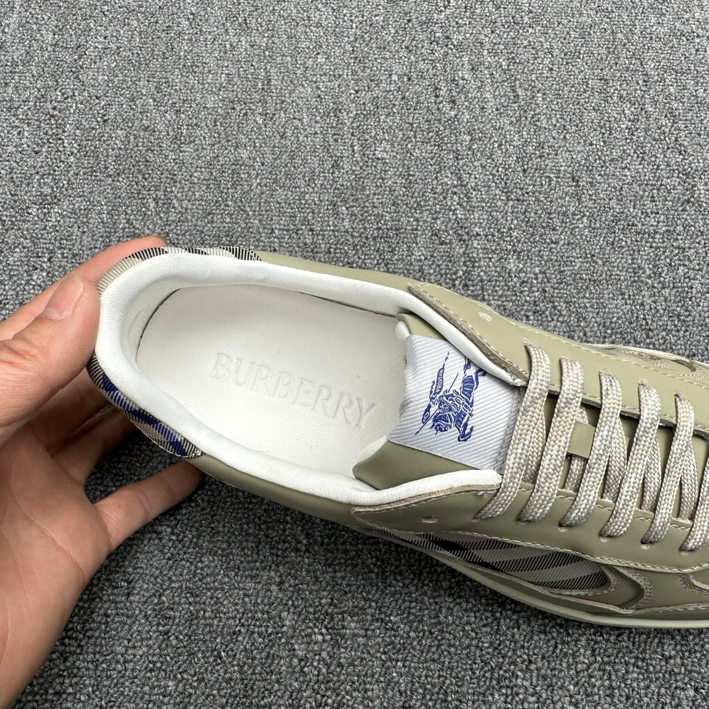 Burberry sneaker interior, beige upper with blue logo on insole and check trim
