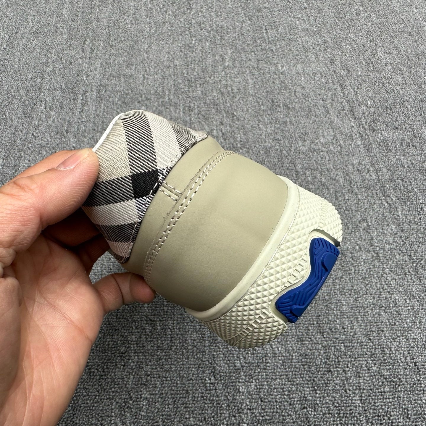 Burberry sneaker heel, beige sole with blue rubber logo and check interior lining