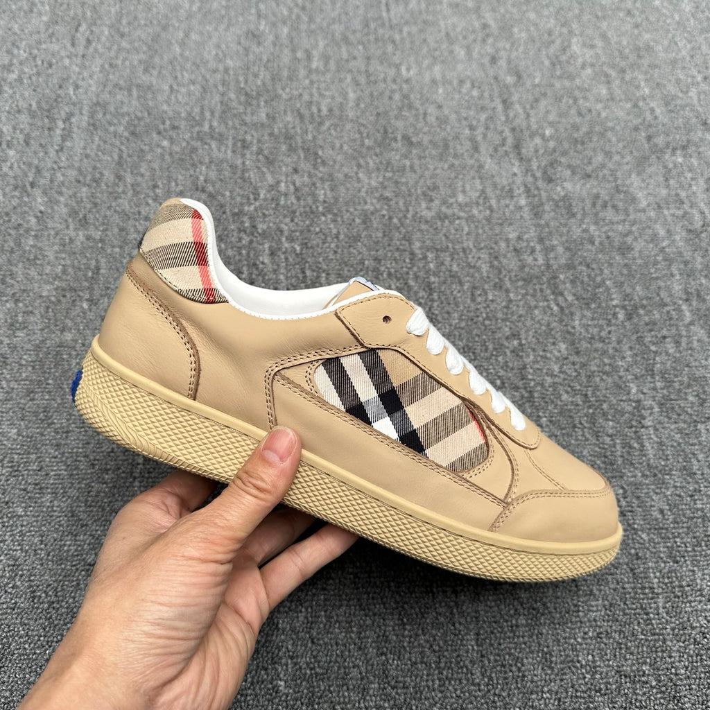 Burberry beige sneaker held up, side view with check panel and white laces